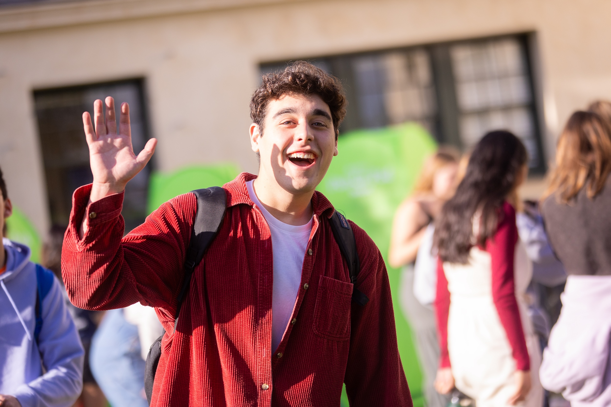 westmont student waving to the camera