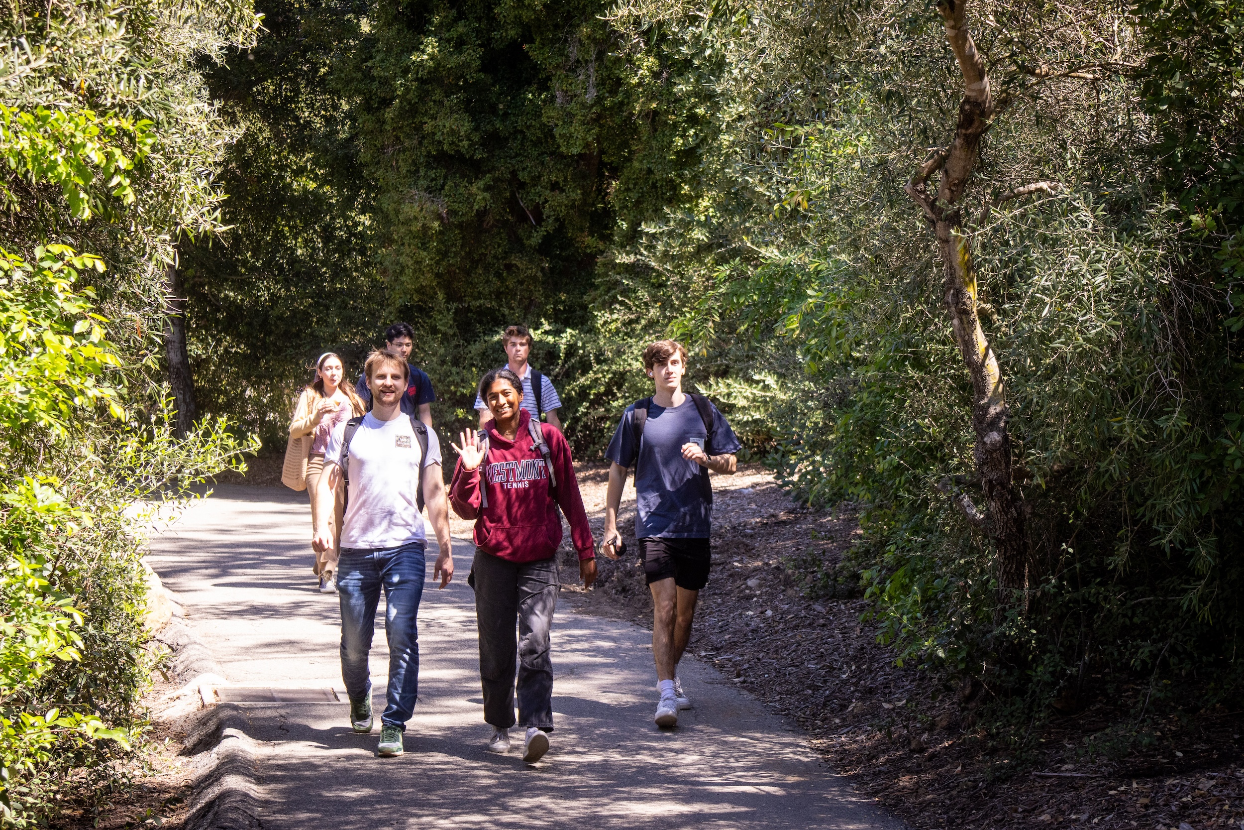 students walking on campus to class