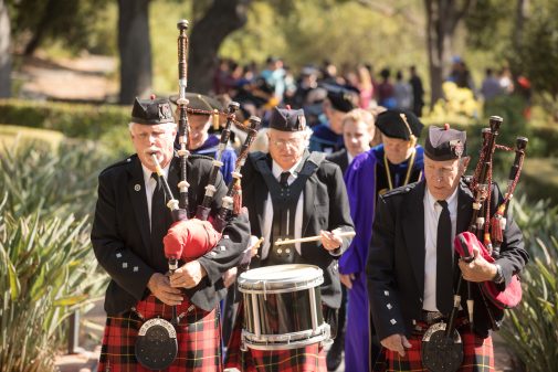 Led by bagpipers, the incoming class makes its First Walk through the Formal Garden