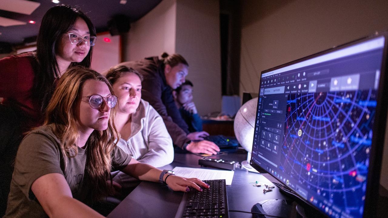 Astrophysics Minor students looking at data on computer