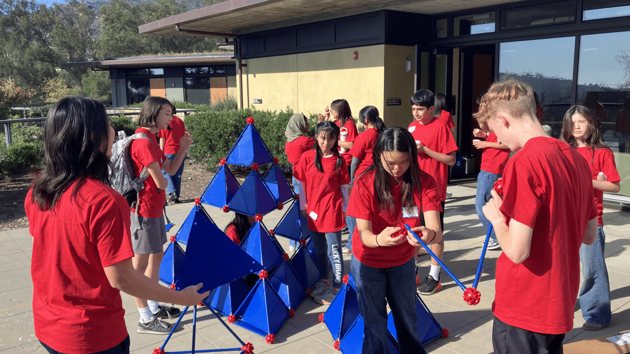 Students work on a math construction together at Math Field Day
