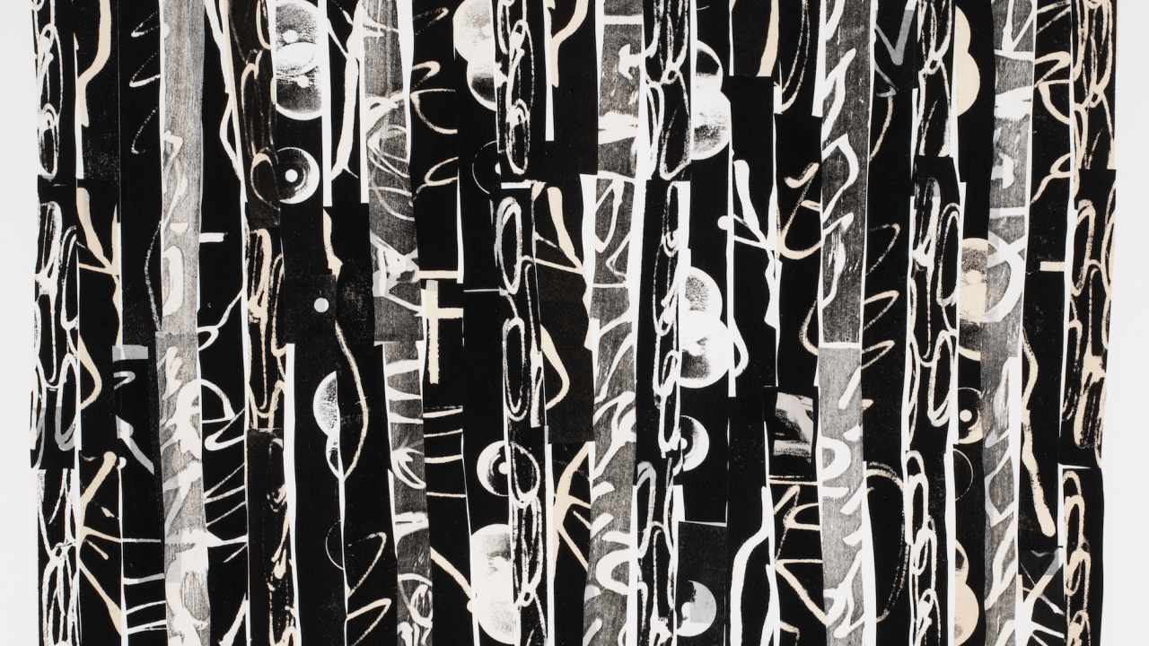 Black and white strips of paper arranged in a row.